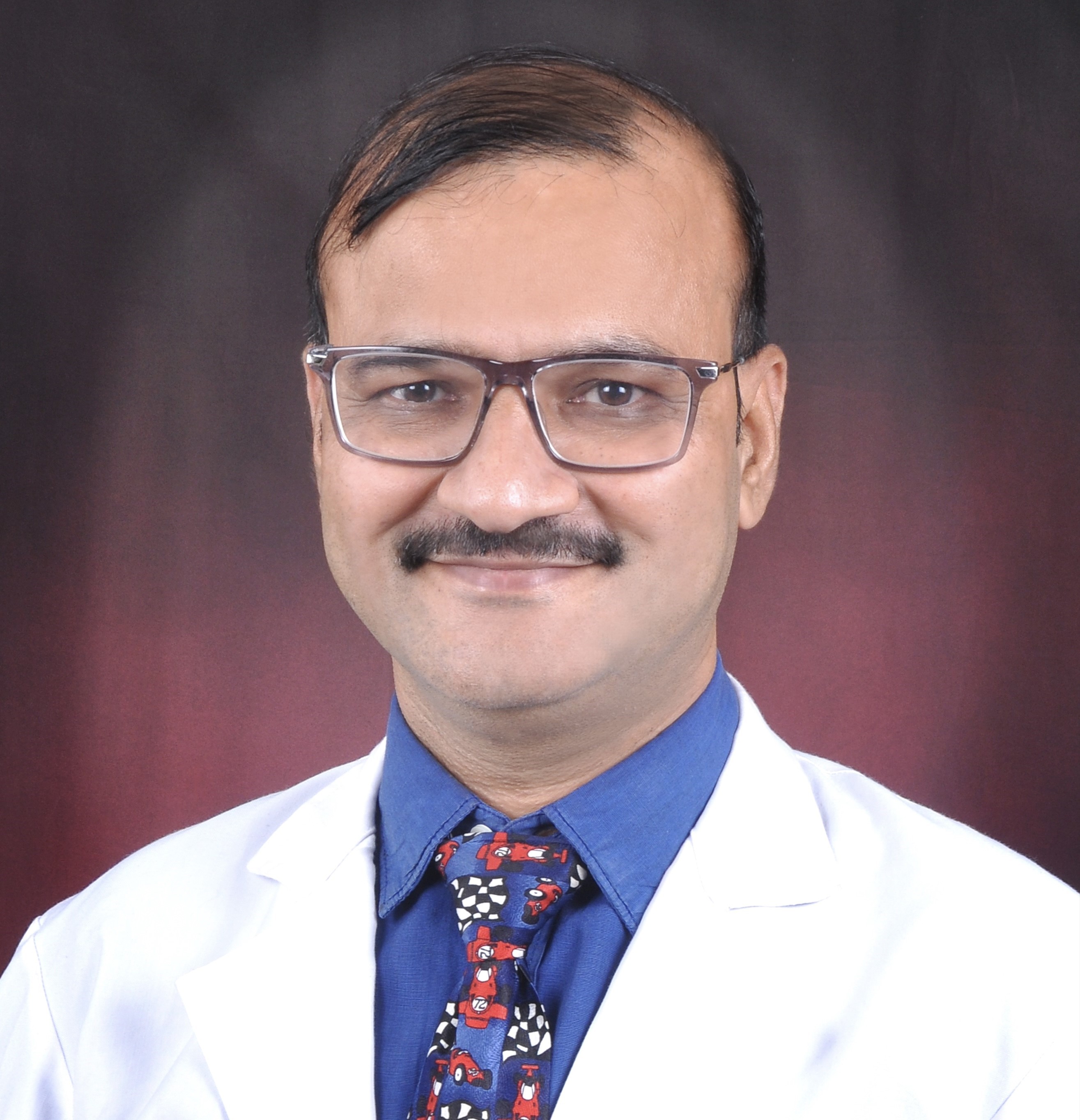 Dr. Mangesh